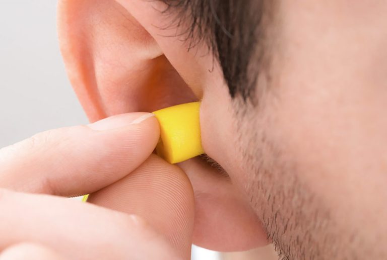 Person Ear With Earplug