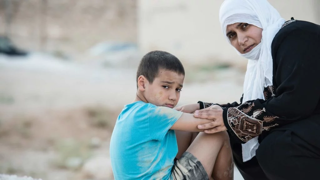 Decision Science | Arts & Culture Fundraising | Asian refugee mother with son - slide