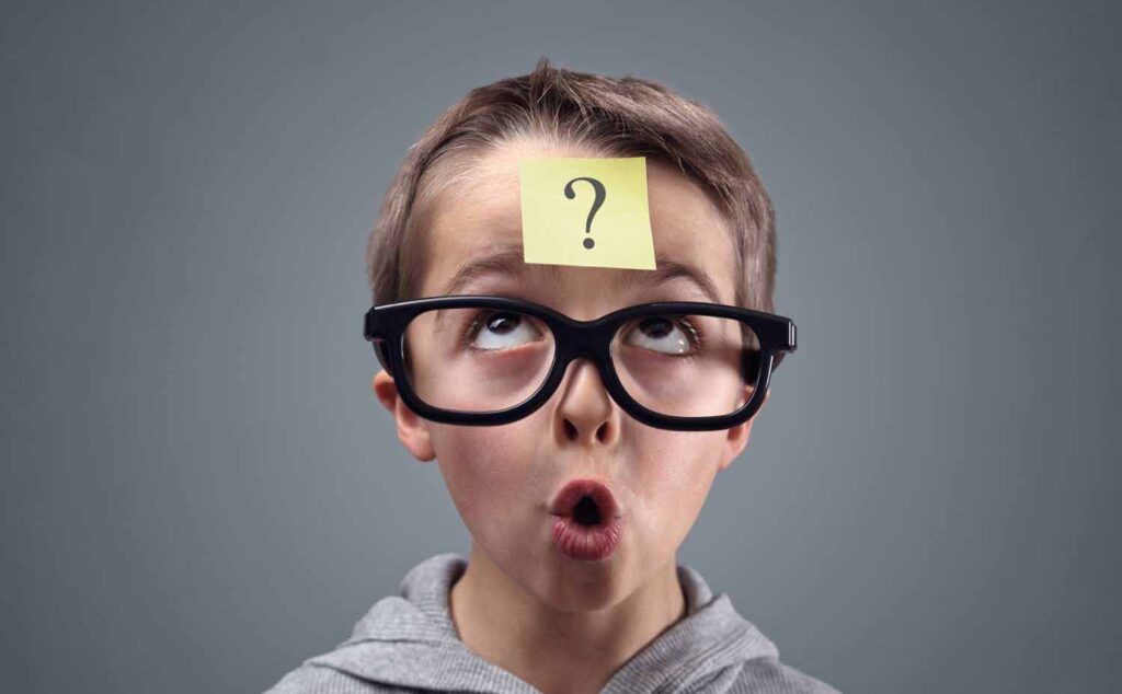 Decision Science | Boy looking at question mark for AI quiz